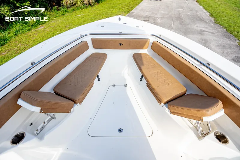 Slide: The Image of 2024 Sea Pro 239 Deep V CC boat with spacious bow seating and sleek design. - 13