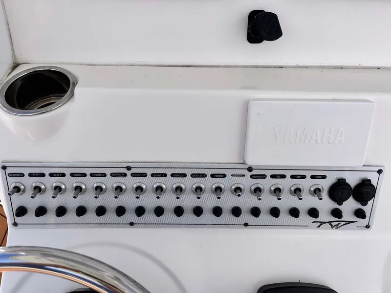 Slide: The Image of Control panel of 2015 Tidewater 280 CC Adventure boat with Yamaha branding. - 10