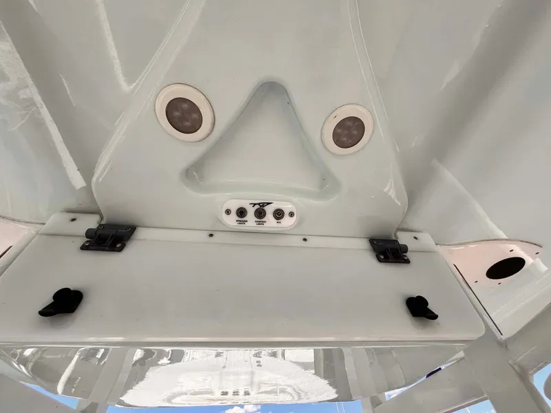 Slide: The Image of 2015 Tidewater 280 CC Adventure boat console with speakers and controls. - 13