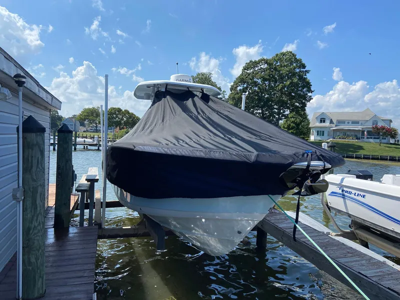 Slide: The Image of 2015 Tidewater 280 CC Adventure boat covered at dockside. - 28