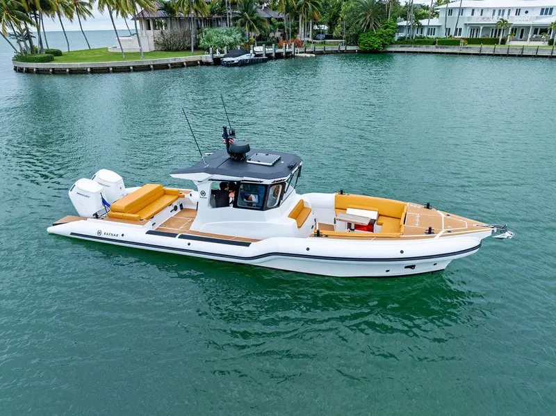 Slide: The Image of 2022 Rafnar Targa 40 boat on calm water, featuring sleek design and spacious deck. - 1