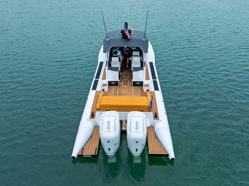 Slide: The Image of 2022 Rafnar Targa 40 boat on water, rear view with dual engines. - 12