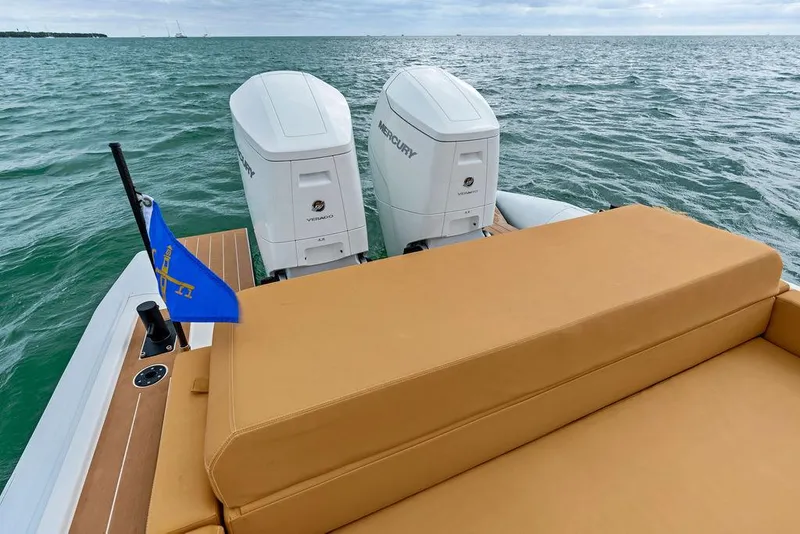 Slide: The Image of Rafnar Targa 40 boat with twin Mercury engines, 2022 model, on open water. - 15