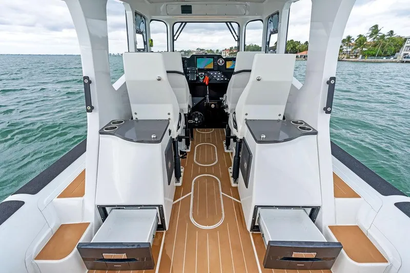 Slide: The Image of Interior of 2022 Rafnar Targa 40 boat with modern seating and ocean view. - 18