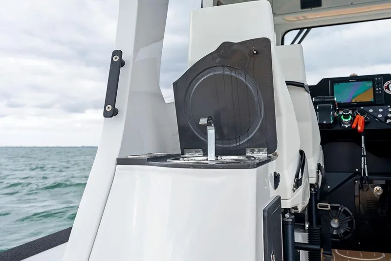 Slide: The Image of Rafnar Targa 40 boat interior with modern controls, 2022 model, on open water. - 20