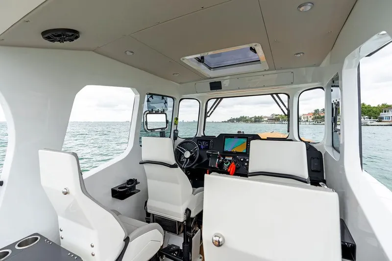 Slide: The Image of Interior of 2022 Rafnar Targa 40 boat with modern navigation equipment and seating. - 21