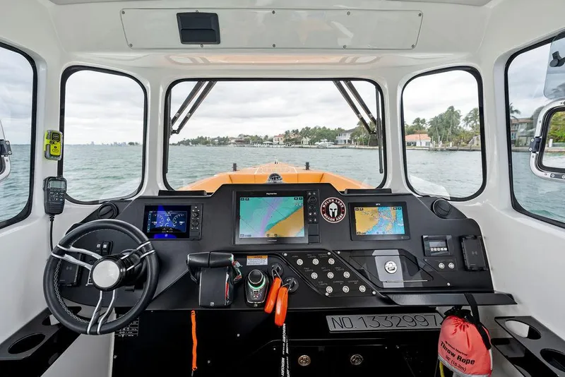 Slide: The Image of Interior view of 2022 Rafnar Targa 40 boat cockpit with navigation equipment. - 23
