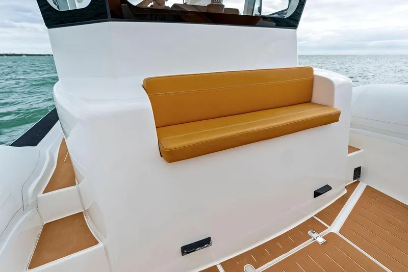 Slide: The Image of Rafnar Targa 40 boat, 2022 model, featuring a sleek white exterior and tan seating. - 26