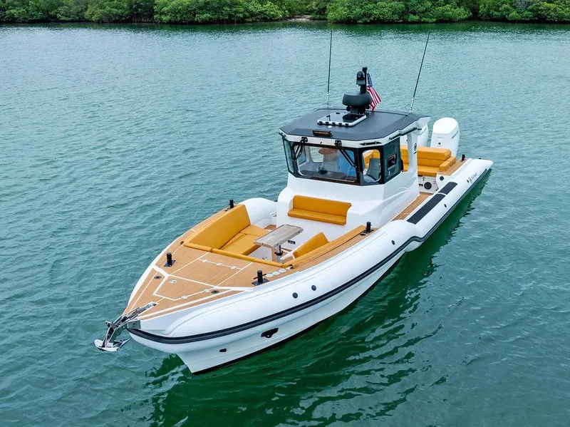 Slide: The Image of 2022 Rafnar Targa 40 boat on calm water, featuring sleek design and modern amenities. - 5