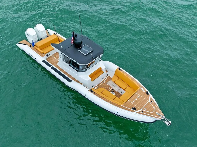 Slide: The Image of Rafnar Targa 40, 2022 model, luxury boat on clear water, aerial view. - 6