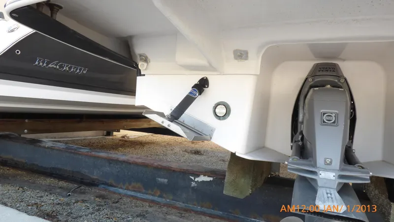 Slide: The Image of 2018 Regal 28 Express boat stern and outdrive on trailer. - 10