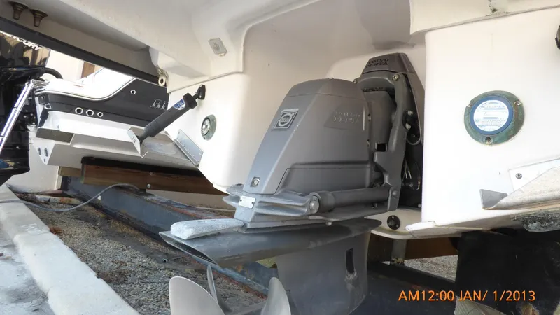 Slide: The Image of 2018 Regal 28 Express boat stern drive and propeller detail. - 12