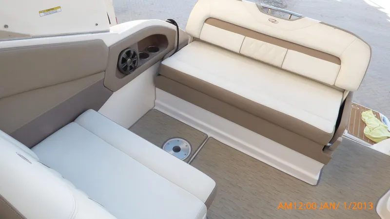 Slide: The Image of Interior seating of 2018 Regal 28 Express boat with beige upholstery. - 21