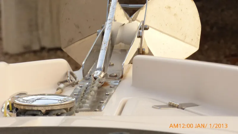 Slide: The Image of Close-up of 2018 Regal 28 Express boat anchor and chain mechanism. - 25