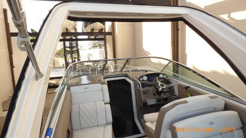 Slide: The Image of 2018 Regal 28 Express boat interior with steering wheel and seating. - 42