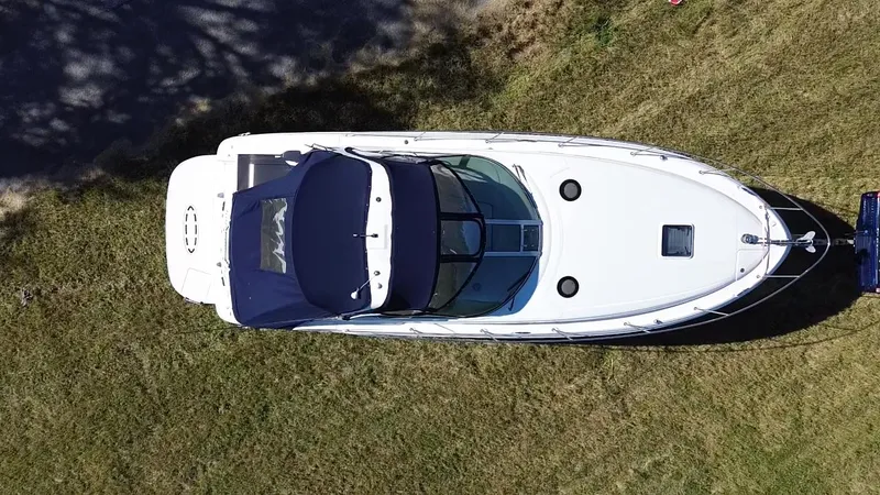 Slide: The Image of Aerial view of 2006 Sea Ray 320 Sundancer boat on grass. - 12