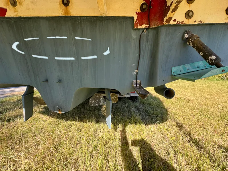 Slide: The Image of 2006 Sea Ray 320 Sundancer boat hull on grass, showing underside details. - 24