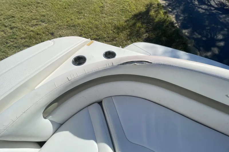 Slide: The Image of Close-up of 2006 Sea Ray 320 Sundancer boat seating with cup holders. - 35
