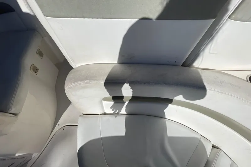 Slide: The Image of Shadow on white leather seating of 2006 Sea Ray 320 Sundancer boat interior. - 38