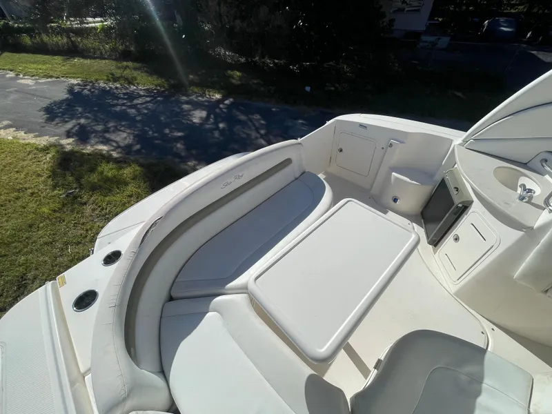Slide: The Image of 2006 Sea Ray 320 Sundancer boat interior with seating and table. - 39