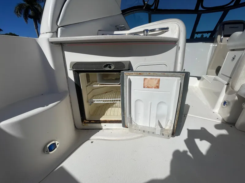 Slide: The Image of Open mini fridge on 2006 Sea Ray 320 Sundancer boat deck. - 44