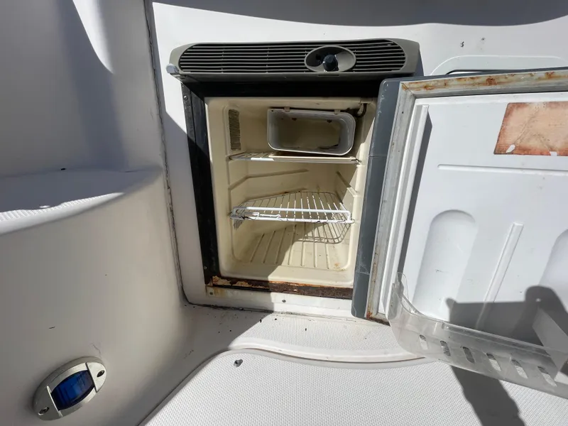 Slide: The Image of Open mini fridge on 2006 Sea Ray 320 Sundancer boat. - 45