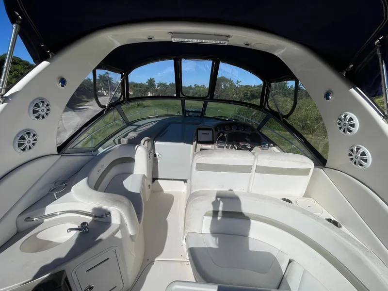 Slide: The Image of 2006 Sea Ray 320 Sundancer boat interior with seating and helm. - 46