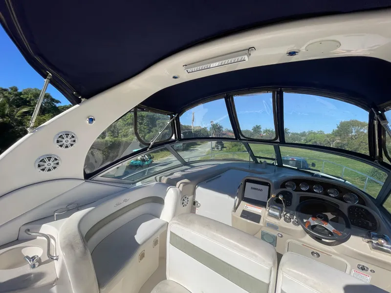 Slide: The Image of Interior view of 2006 Sea Ray 320 Sundancer boat with modern dashboard and seating. - 50
