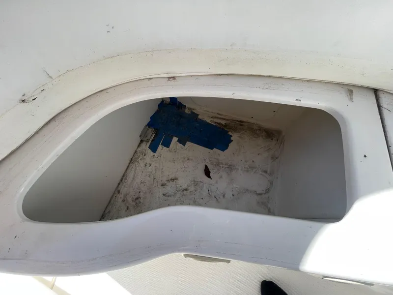 Slide: The Image of Storage compartment on a 2006 Sea Ray 320 Sundancer boat, showing interior condition. - 53