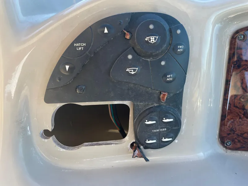 Slide: The Image of Control panel of a 2006 Sea Ray 320 Sundancer boat with missing components. - 61