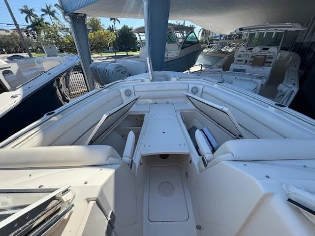 Slide: The Image of 2018 Grady-White Freedom 325 boat interior with seating and storage. - 16