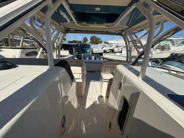 Slide: The Image of 2018 Grady-White Freedom 325 boat interior with seating and open deck view. - 18