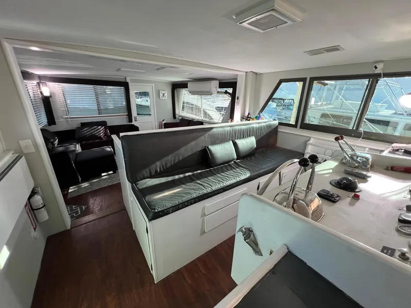 Slide: The Image of Interior of 1975 Hatteras 58 Motor Yacht with modern seating and helm controls. - 11