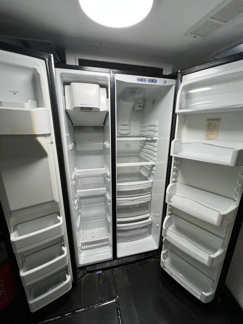 Slide: The Image of Spacious refrigerator interior on a 1975 Hatteras 58 Motor Yacht. - 19