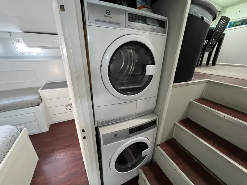 Slide: The Image of Stacked washer and dryer inside 1975 Hatteras 58 Motor Yacht cabin. - 27