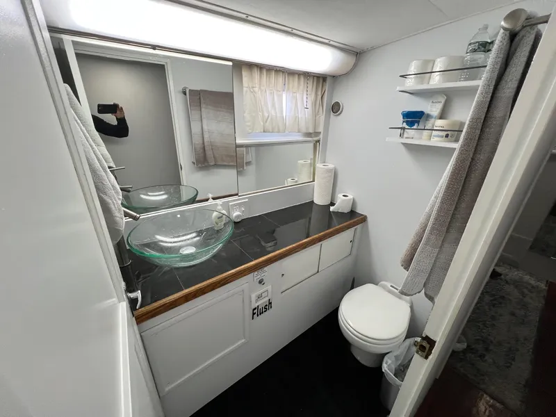 Slide: The Image of Bathroom interior of 1975 Hatteras 58 Motor Yacht with modern glass sink. - 30