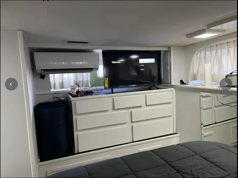 Slide: The Image of Interior of 1975 Hatteras 58 Motor Yacht with TV and storage drawers. - 34