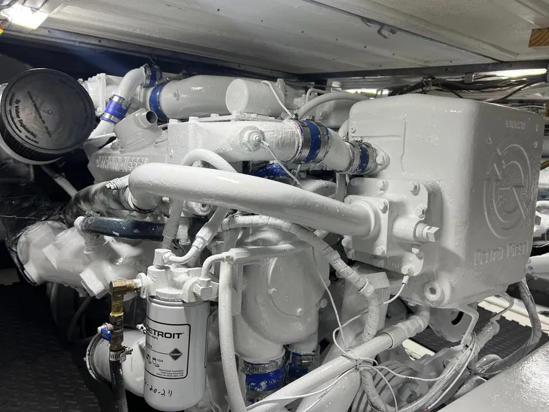 Slide: The Image of Engine room of a 1975 Hatteras 58 Motor Yacht, featuring a Detroit Diesel engine. - 37