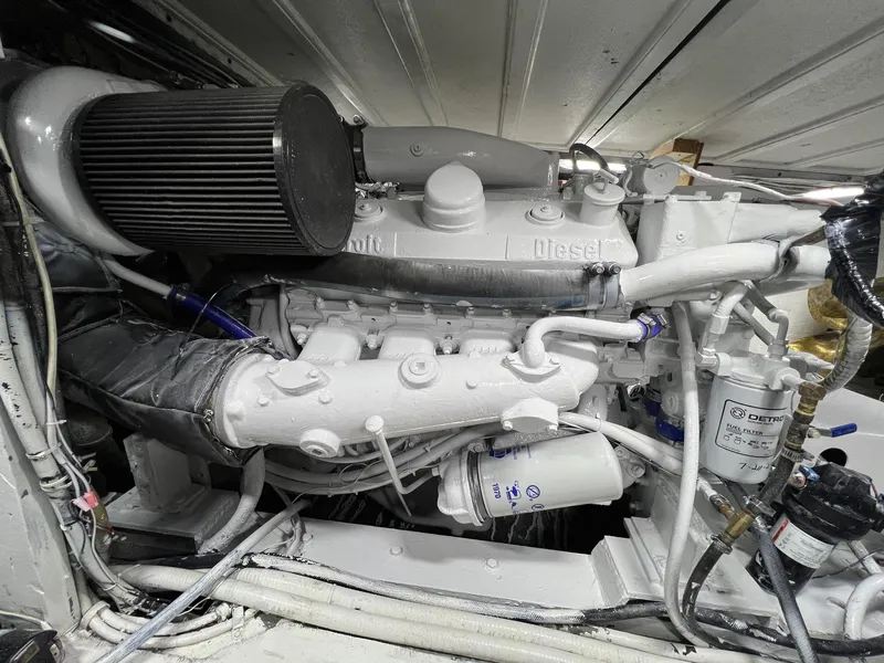 Slide: The Image of Engine of a 1975 Hatteras 58 Motor Yacht, showcasing detailed mechanical components. - 38