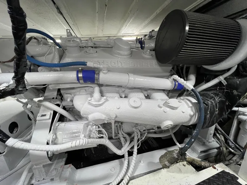Slide: The Image of Engine room of 1975 Hatteras 58 Motor Yacht, showcasing detailed mechanical components. - 39