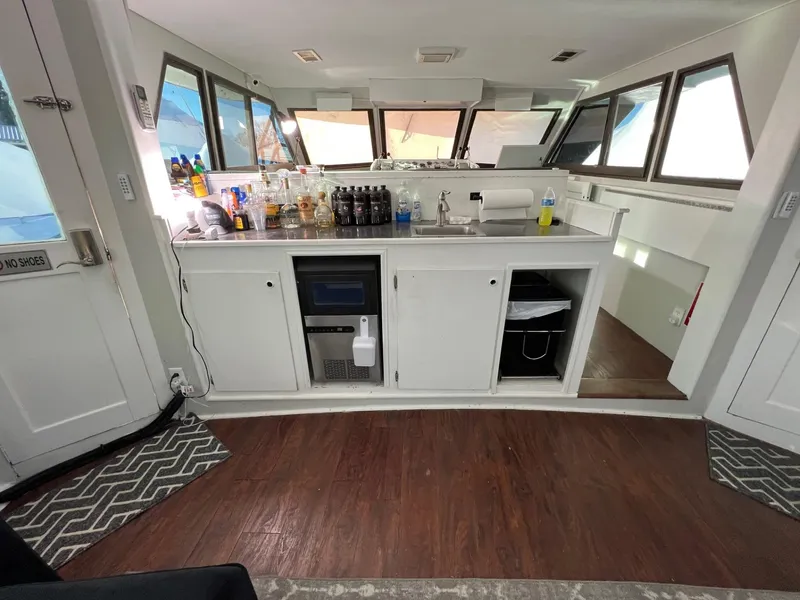 Slide: The Image of Interior of 1975 Hatteras 58 Motor Yacht with modern kitchen amenities. - 7
