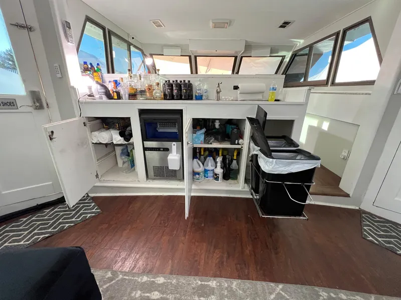 Slide: The Image of Interior of 1975 Hatteras 58 Motor Yacht with bar and storage cabinets. - 8