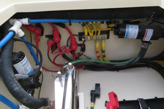 Slide: The Image of 2025 Chris-Craft Catalina 28 engine compartment with wiring and components. - 10