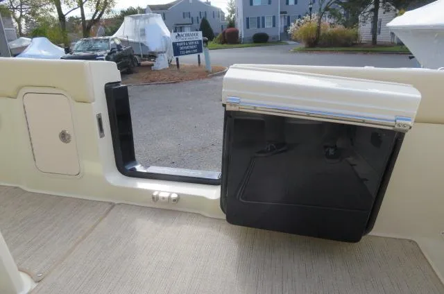 Slide: The Image of 2025 Chris-Craft Catalina 28 boat interior, featuring a sleek door and storage compartment. - 14