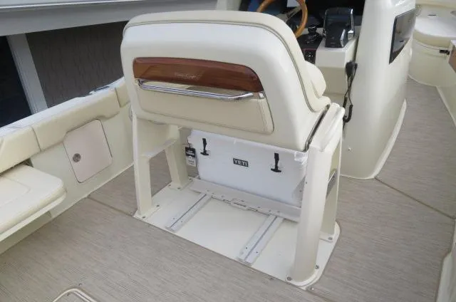 Slide: The Image of 2025 Chris-Craft Catalina 28 boat interior with seating and storage. - 19