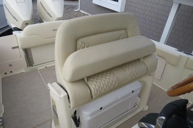 Slide: The Image of 2025 Chris-Craft Catalina 28 boat interior with beige seating and modern design. - 20