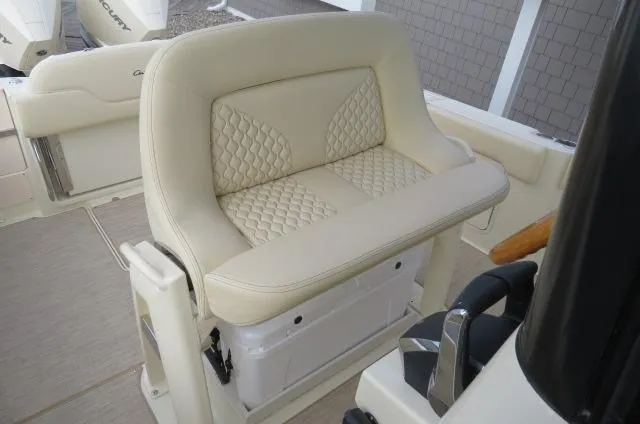 Slide: The Image of Chris-Craft Catalina 28 (2025) boat seat with quilted beige upholstery. - 21