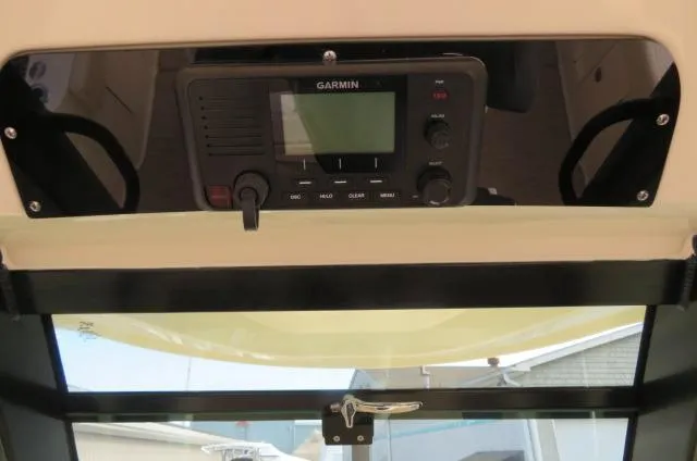 Slide: The Image of Garmin marine radio on 2025 Chris-Craft Catalina 28 dashboard. - 23