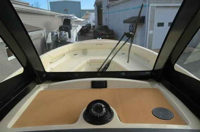 Slide: The Image of 2025 Chris-Craft Catalina 28 boat interior with windshield and dashboard view. - 24