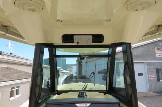 Slide: The Image of 2025 Chris-Craft Catalina 28 boat interior with windshield and roof speakers. - 25